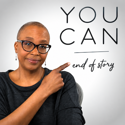 Edie Clarke pointing to the words “You Can” with an encouraging expression